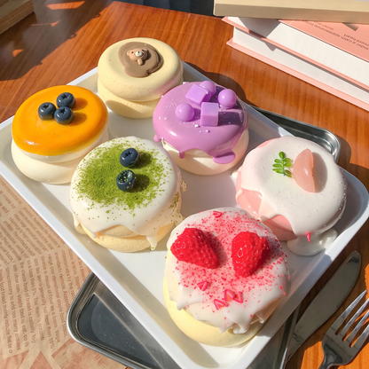 Cute, slow-rise strawberry cake soufflé stress-relief toy; a beautifully crafted, realistic-looking miniature item perfect for dollhouses or as a fun, tactile fidget toy.