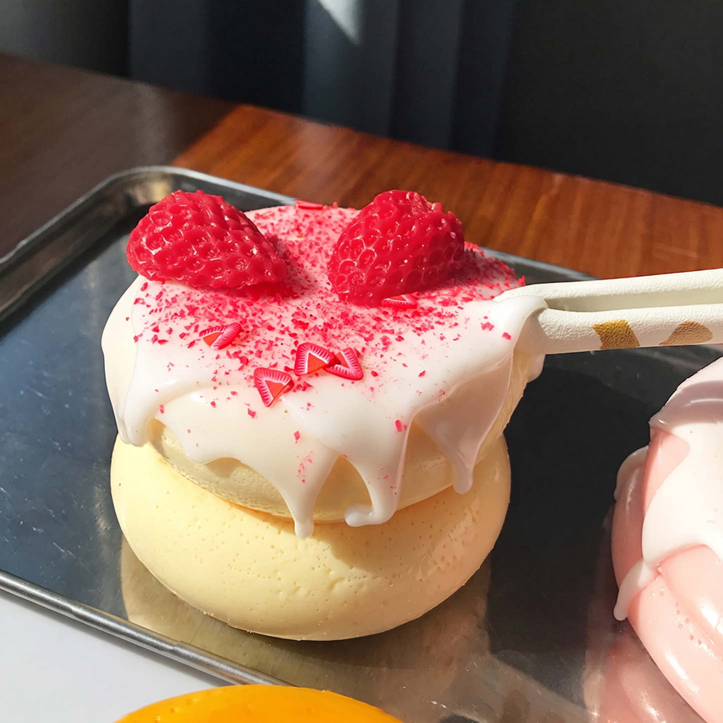 Cute, slow-rise strawberry cake soufflé stress-relief toy; a beautifully crafted, realistic-looking miniature item perfect for dollhouses or as a fun, tactile fidget toy.