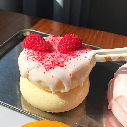 Cute, slow-rise strawberry cake soufflé stress-relief toy; a beautifully crafted, realistic-looking miniature item perfect for dollhouses or as a fun, tactile fidget toy.