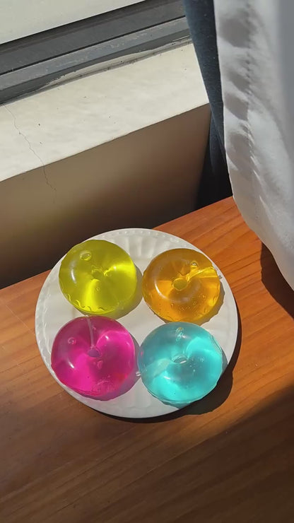 Solid-color maltose-filled donut squeeze toy – moldable, slow-rise, stress-relief, and grip-friendly.