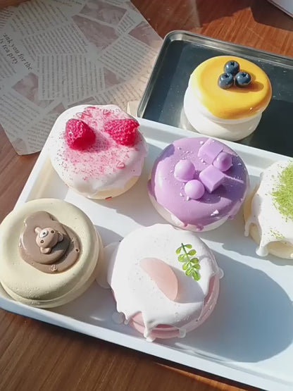 Cute, slow-rise strawberry cake soufflé stress-relief toy; a beautifully crafted, realistic-looking miniature item perfect for dollhouses or as a fun, tactile fidget toy.